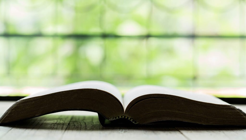 Holy Bible on a wooden table
