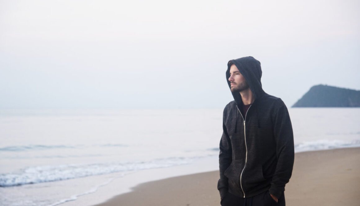 Man walking in solitude at the beach