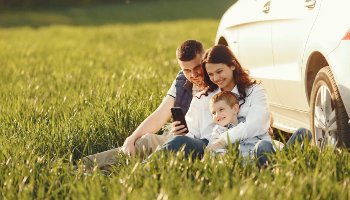 Cute family playing in a summer field