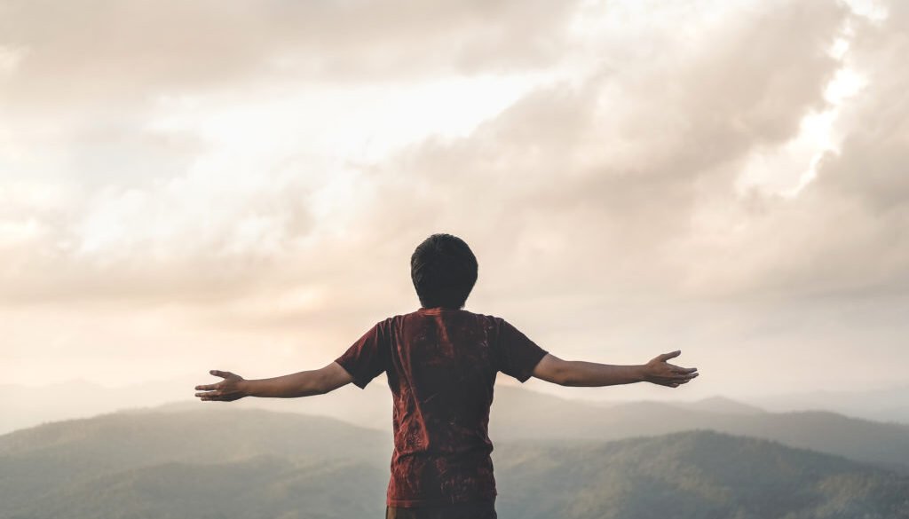 Happy Man Freedom in sunrise nature Successful concept