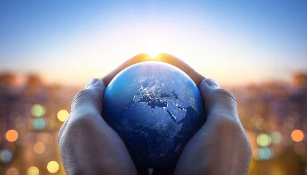 Planet Earth in the hands of a man against the background of the