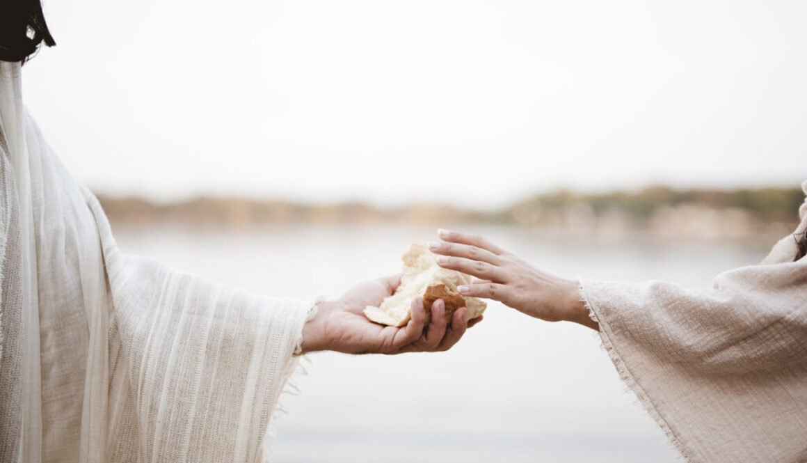 Biblical scene - of Jesus Christ giving bread to a female with a blurred background