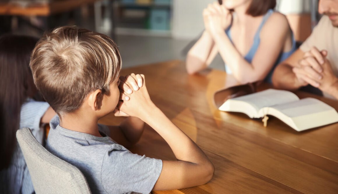 Family praying at home