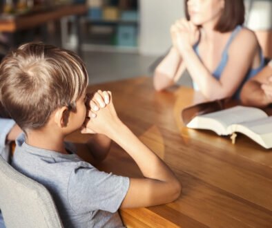 Family praying at home